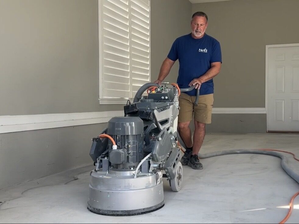 New Wave Resins preparing a concrete surface with grinding equipment