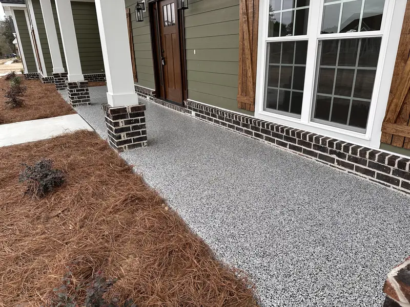 Flake coating on a front porch with brick columns